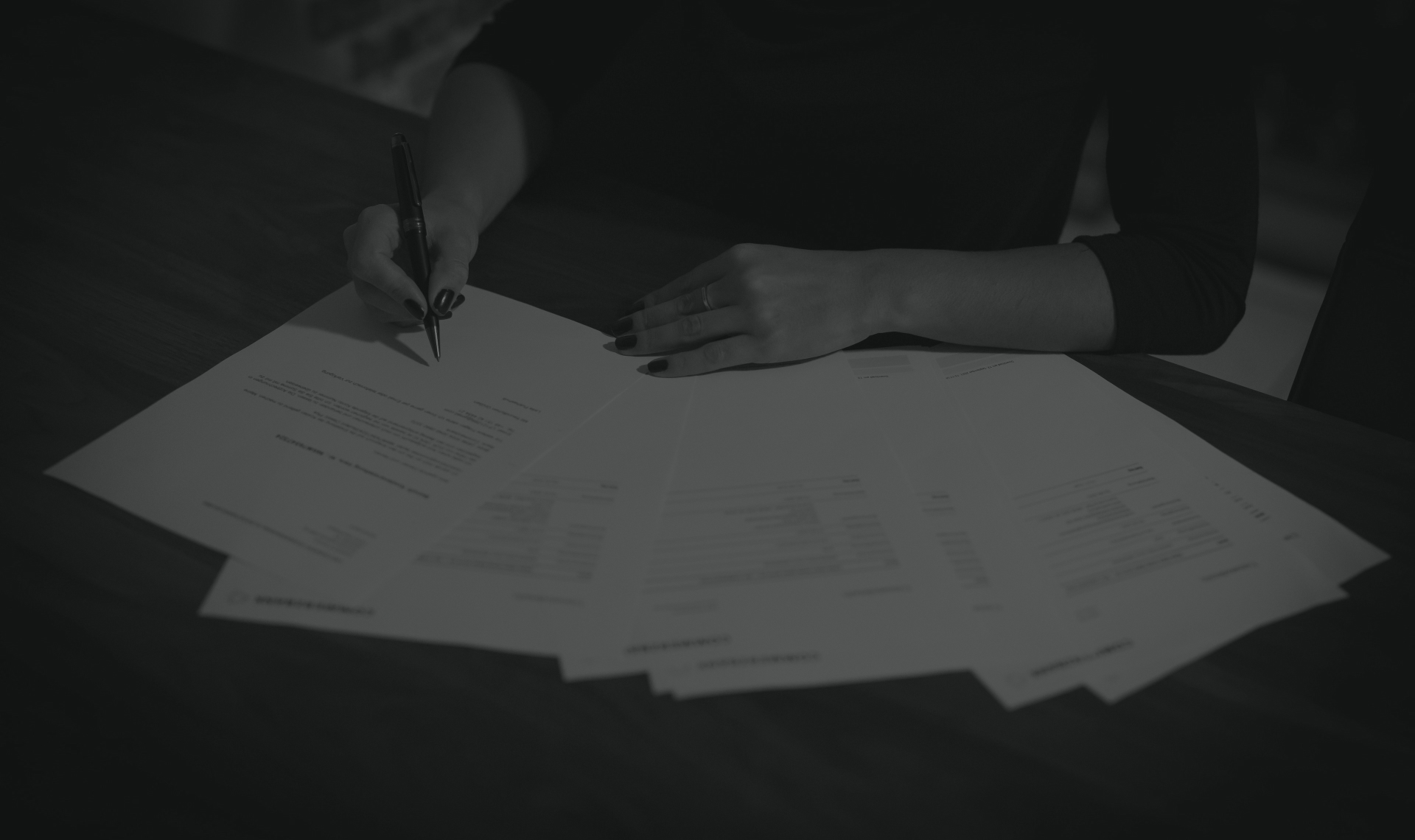 Auditor reviewing a marked-up offering document